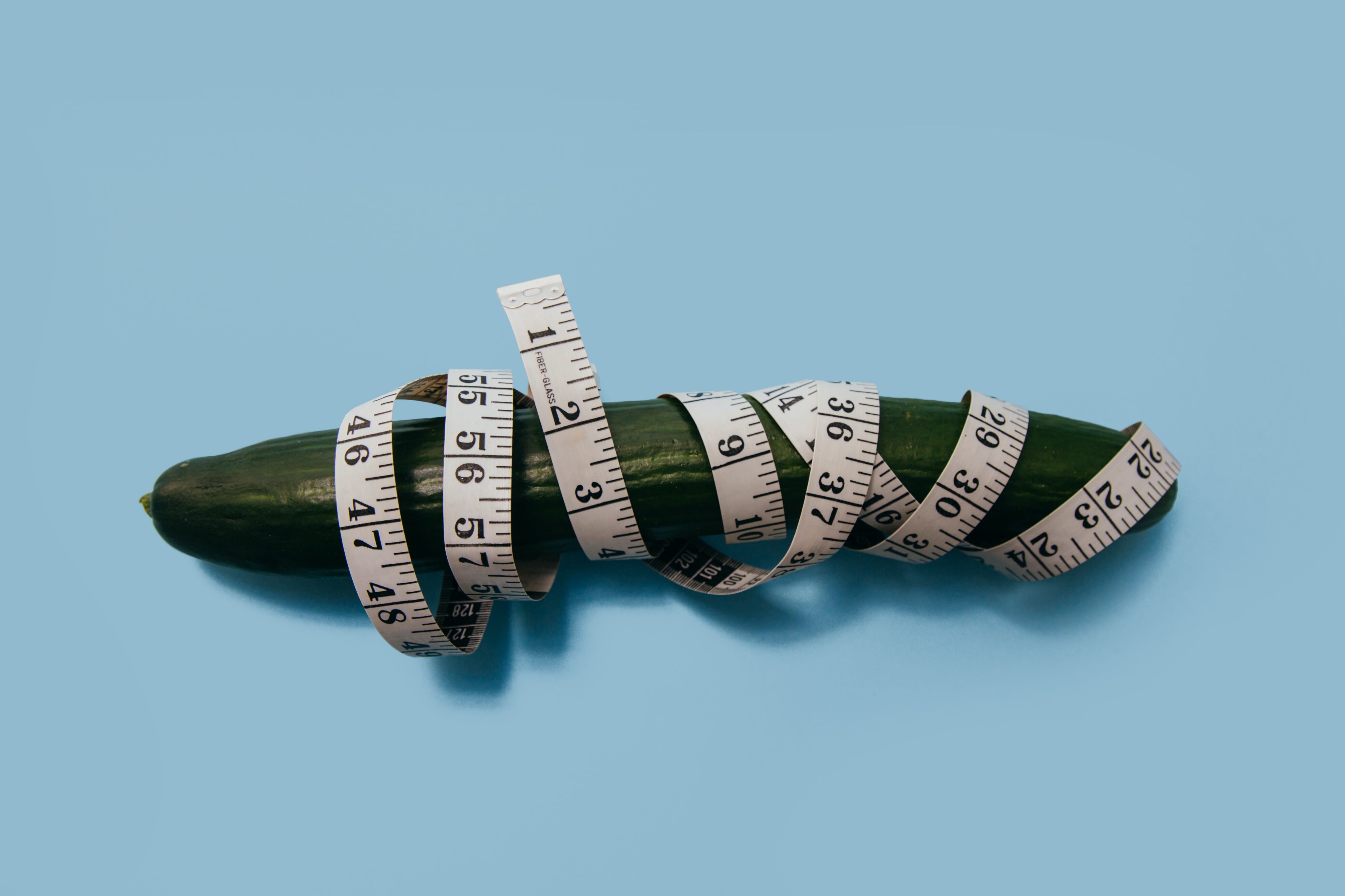 cucumber wrapped in a measuring tape