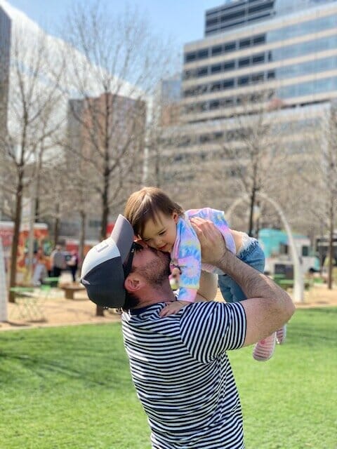 Alex of Pursuing Fatherhood playing with his child in the park