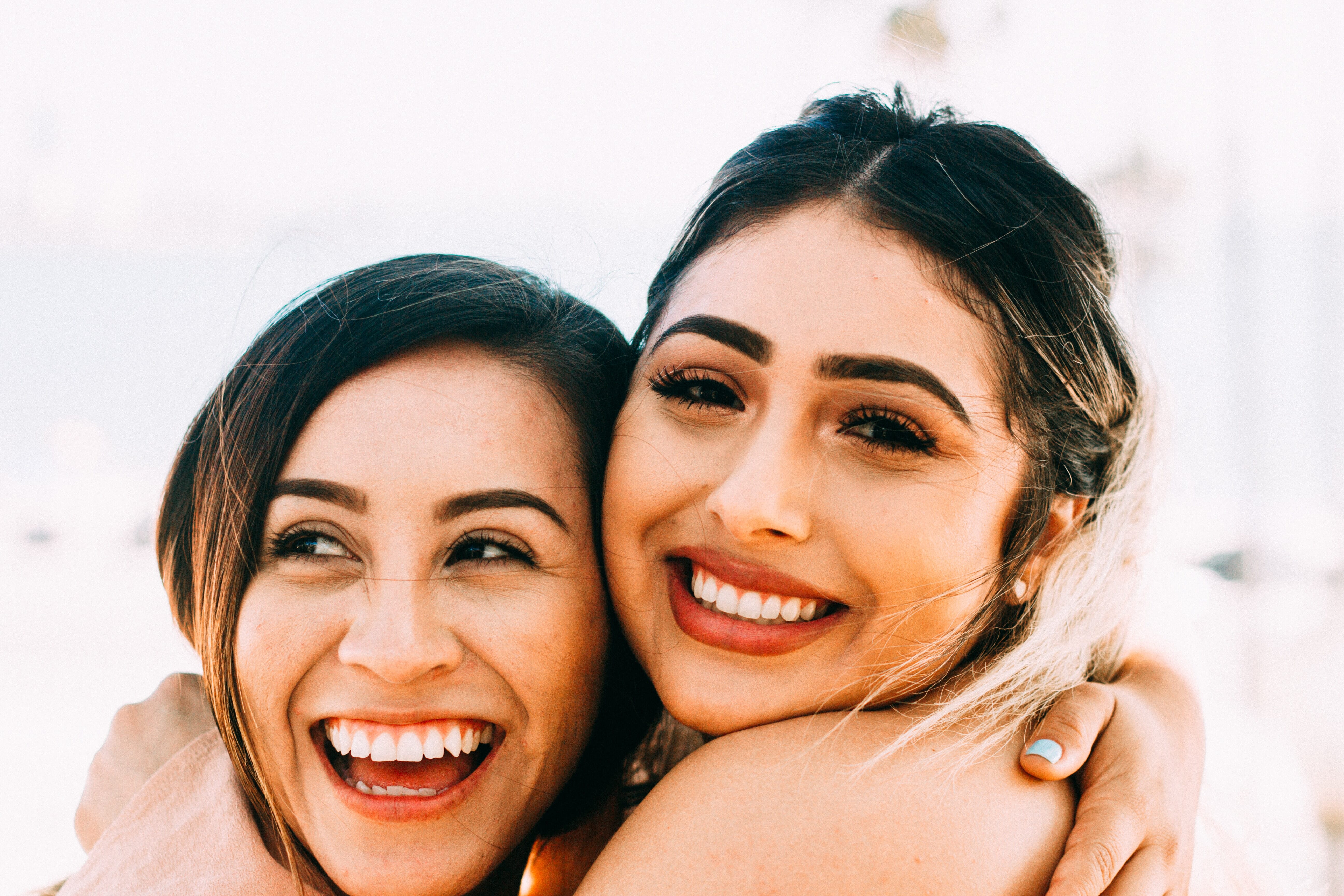 two female friends embracing