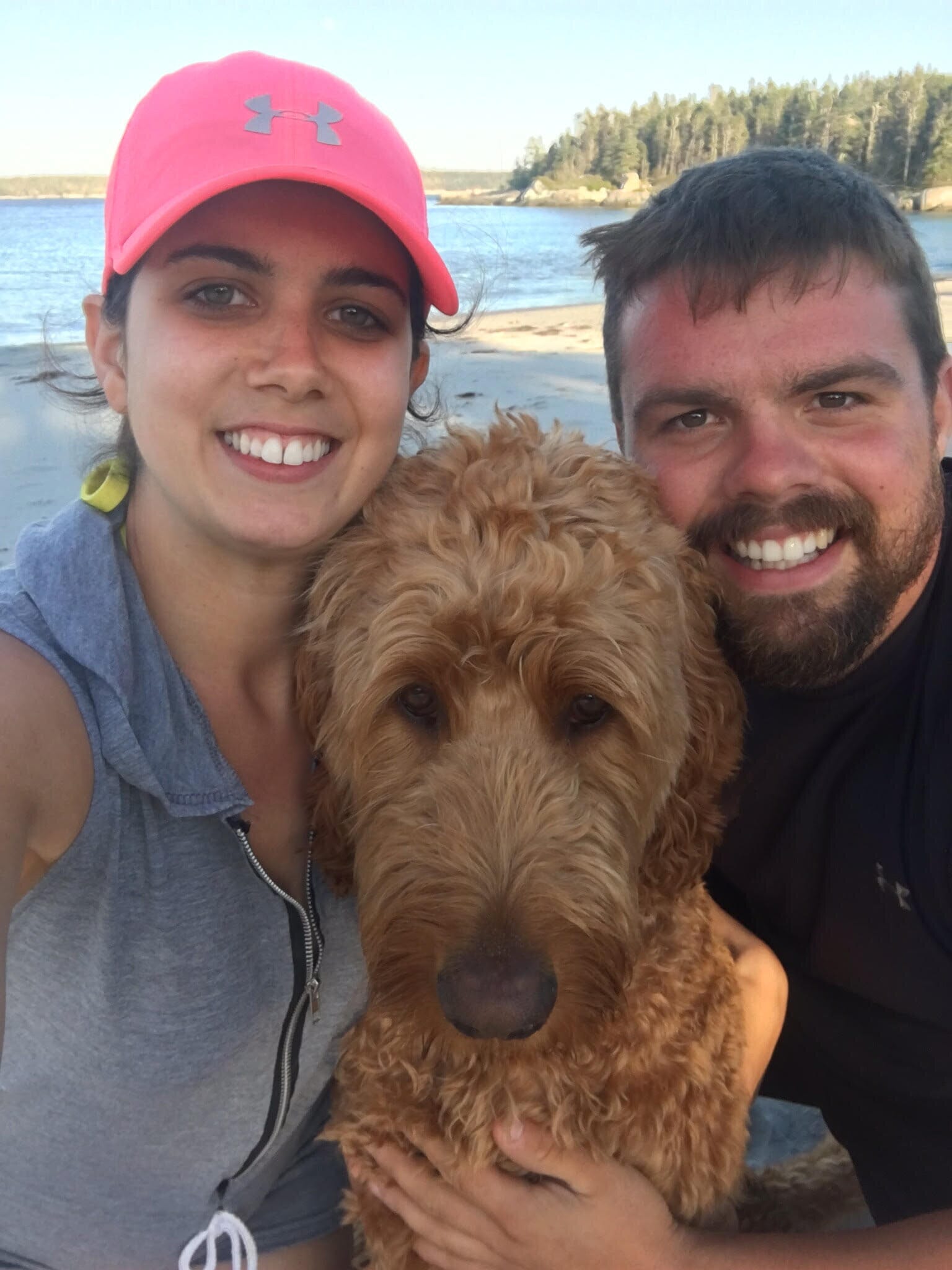 fertility warrior amy baker with her husband and her dog by the water