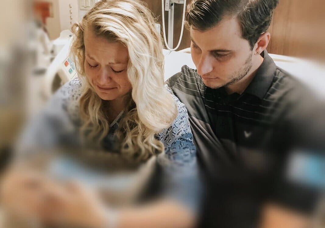 recording artist ashley j. and her husband in the hospital cradling their stillborn child