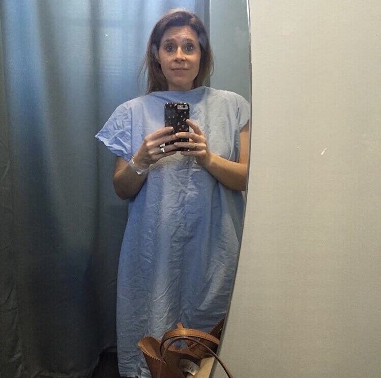 secondary infertility warrior ali prato taking a selfie in a hospital gown