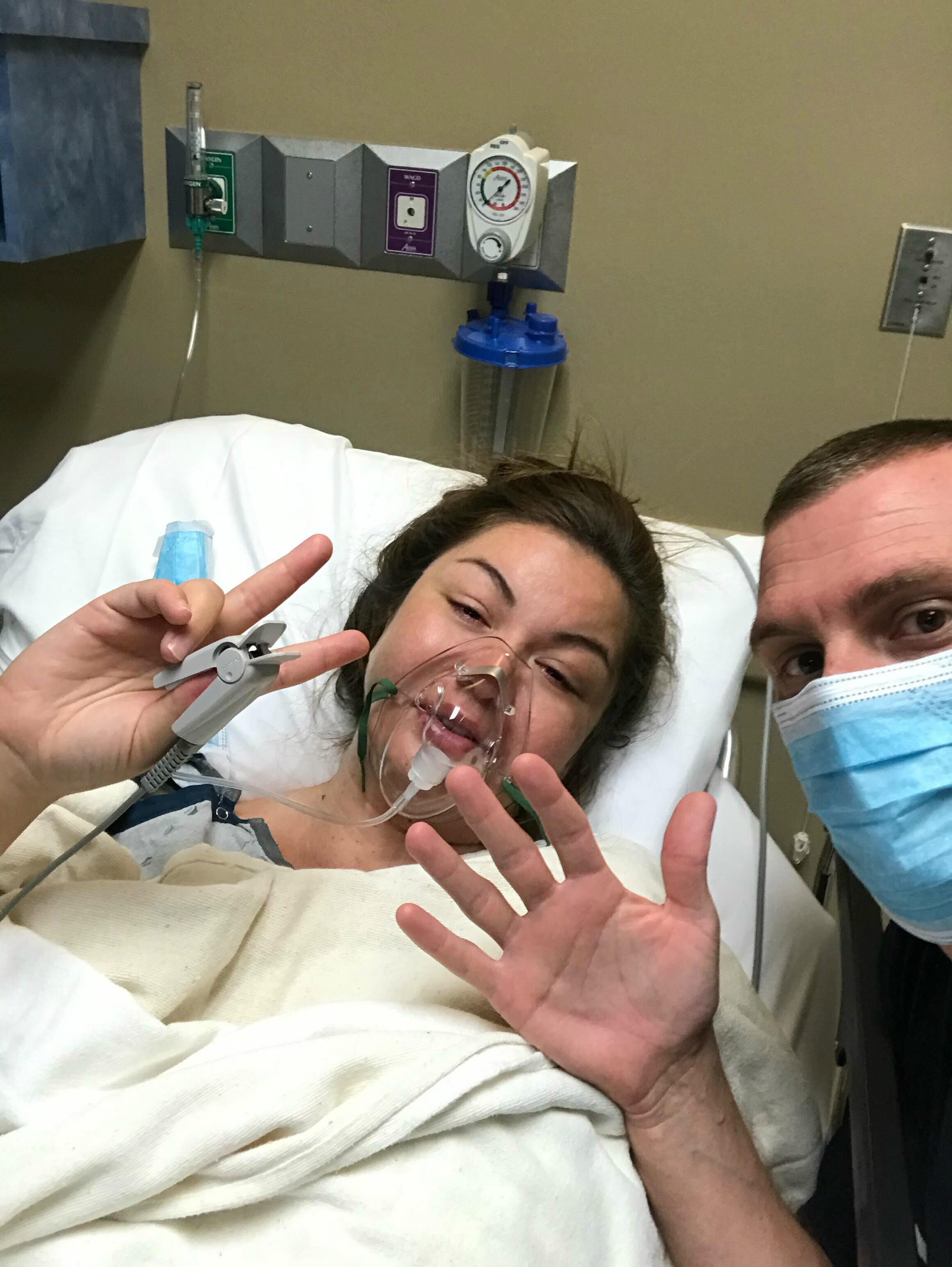 kelsi burley with her husband in the clinic for ivf procedure