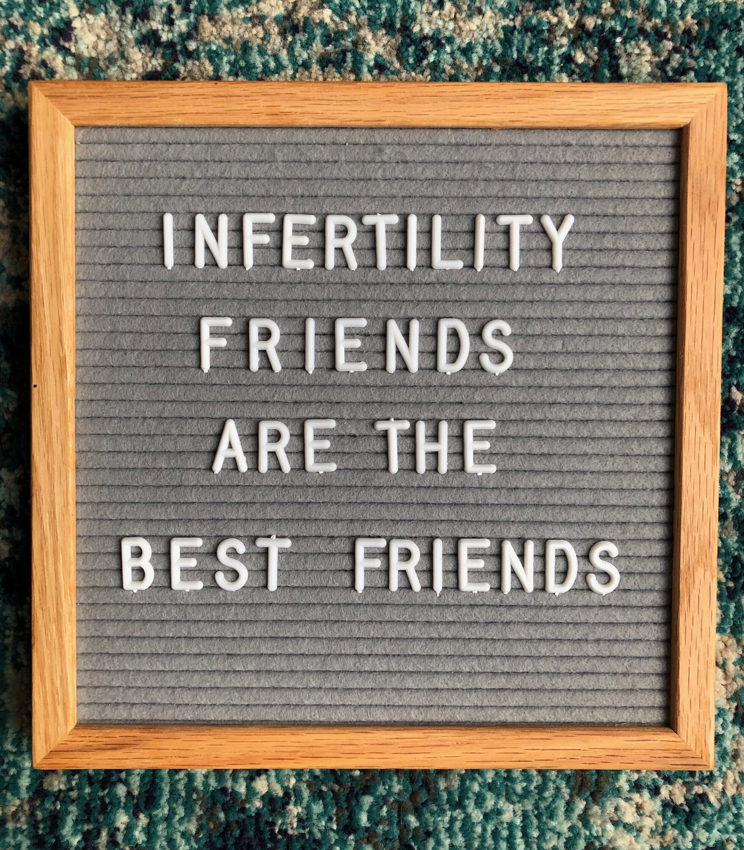 sign that reads "infertility friends are the best friends"
