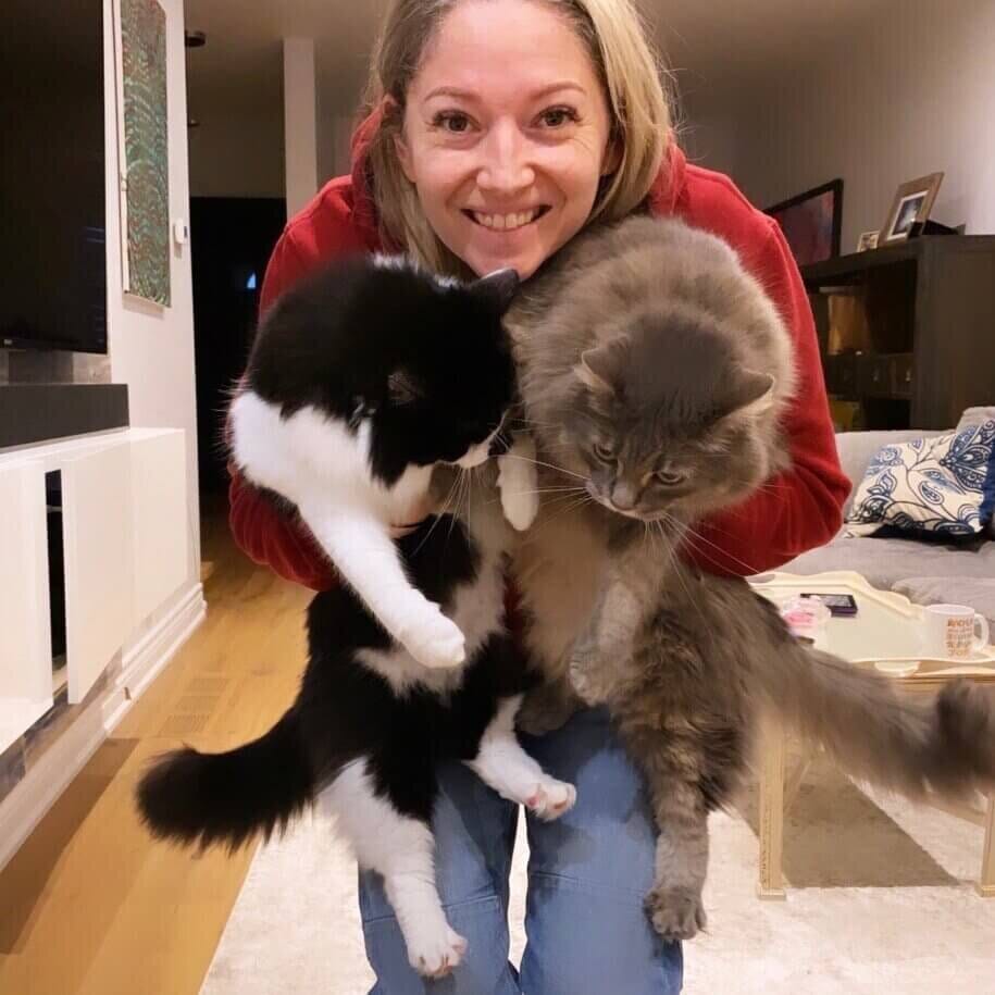 alexandra slate holding her two cats