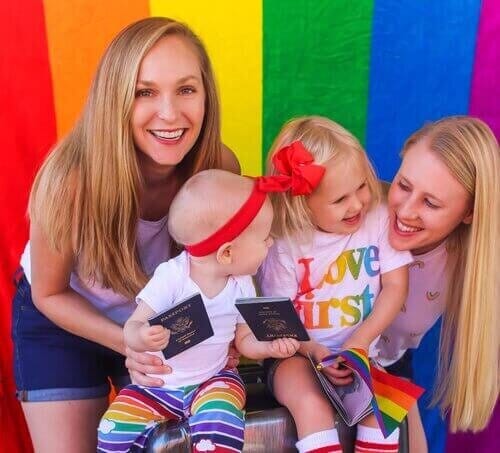 lesbian family holding passports