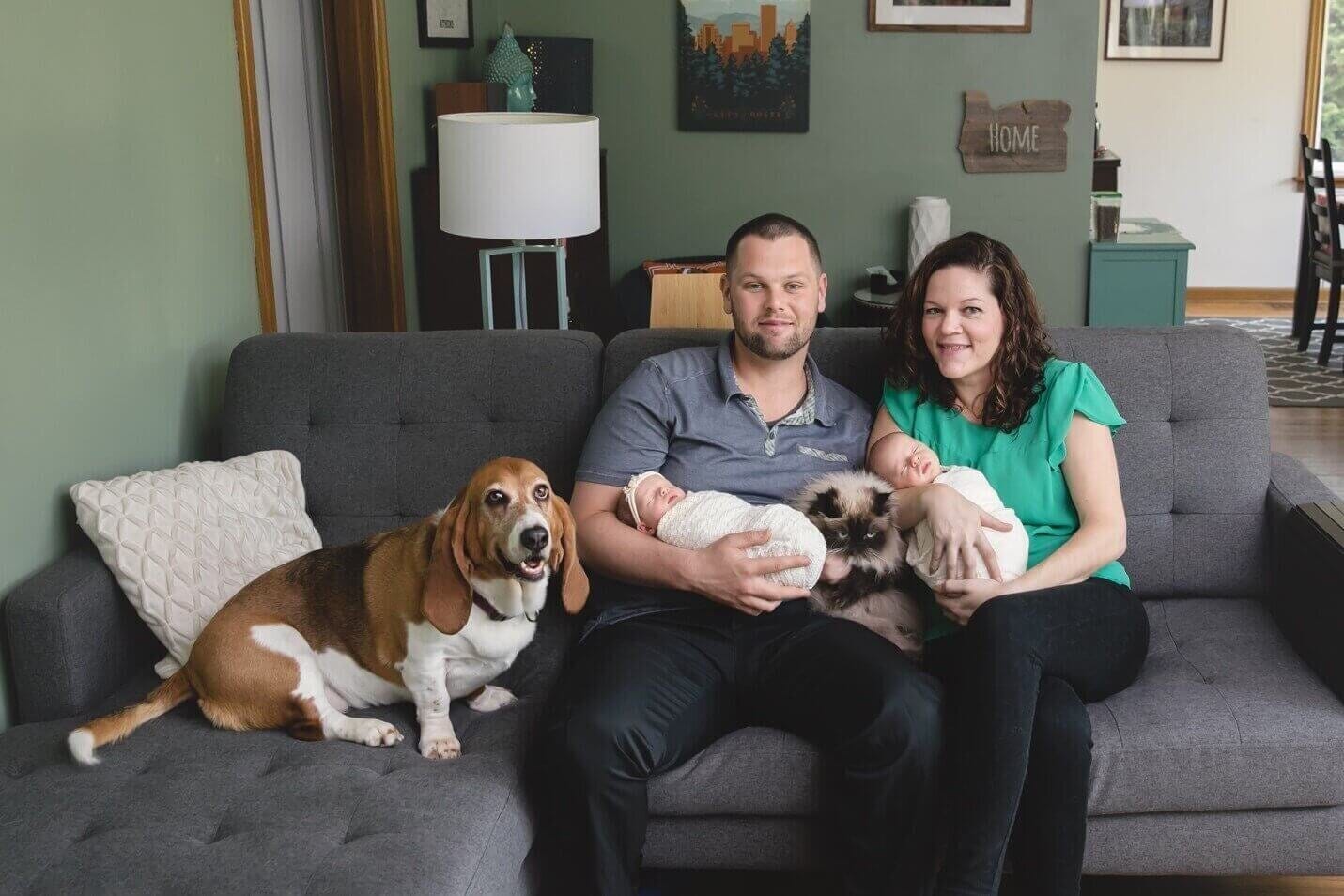 infertility warrior elizabeth osberger with her husband, twins, dog, and cat at home