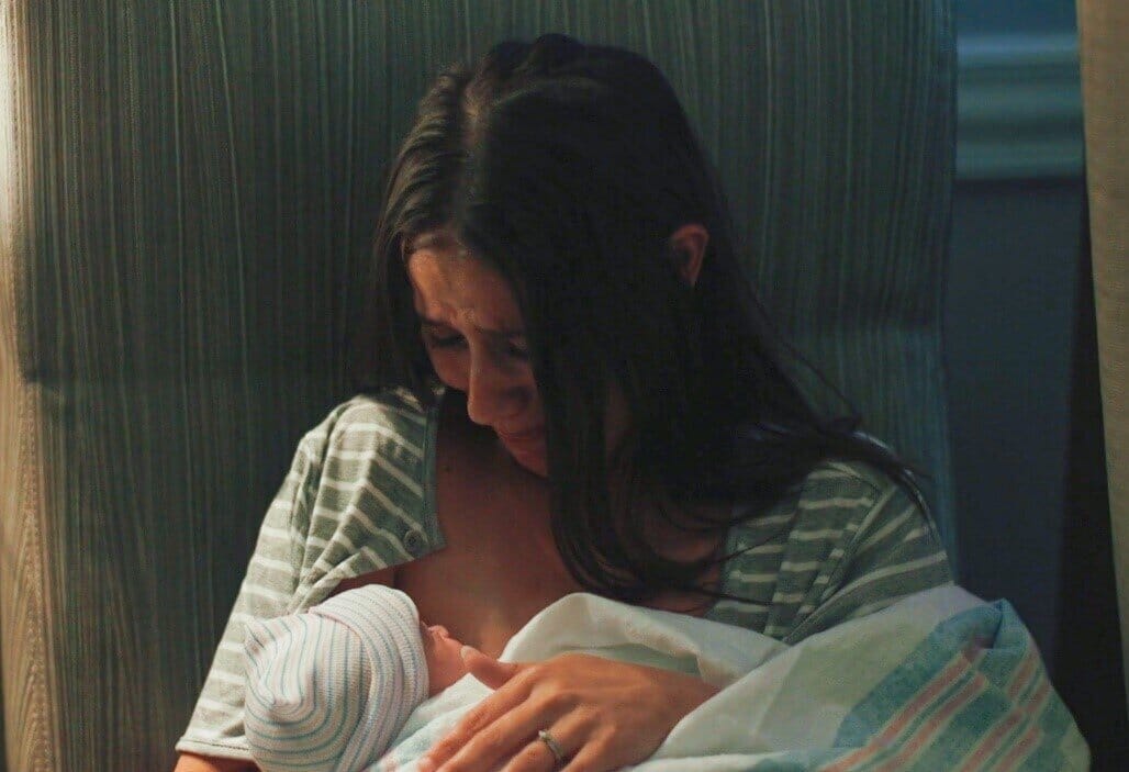woman nursing a baby