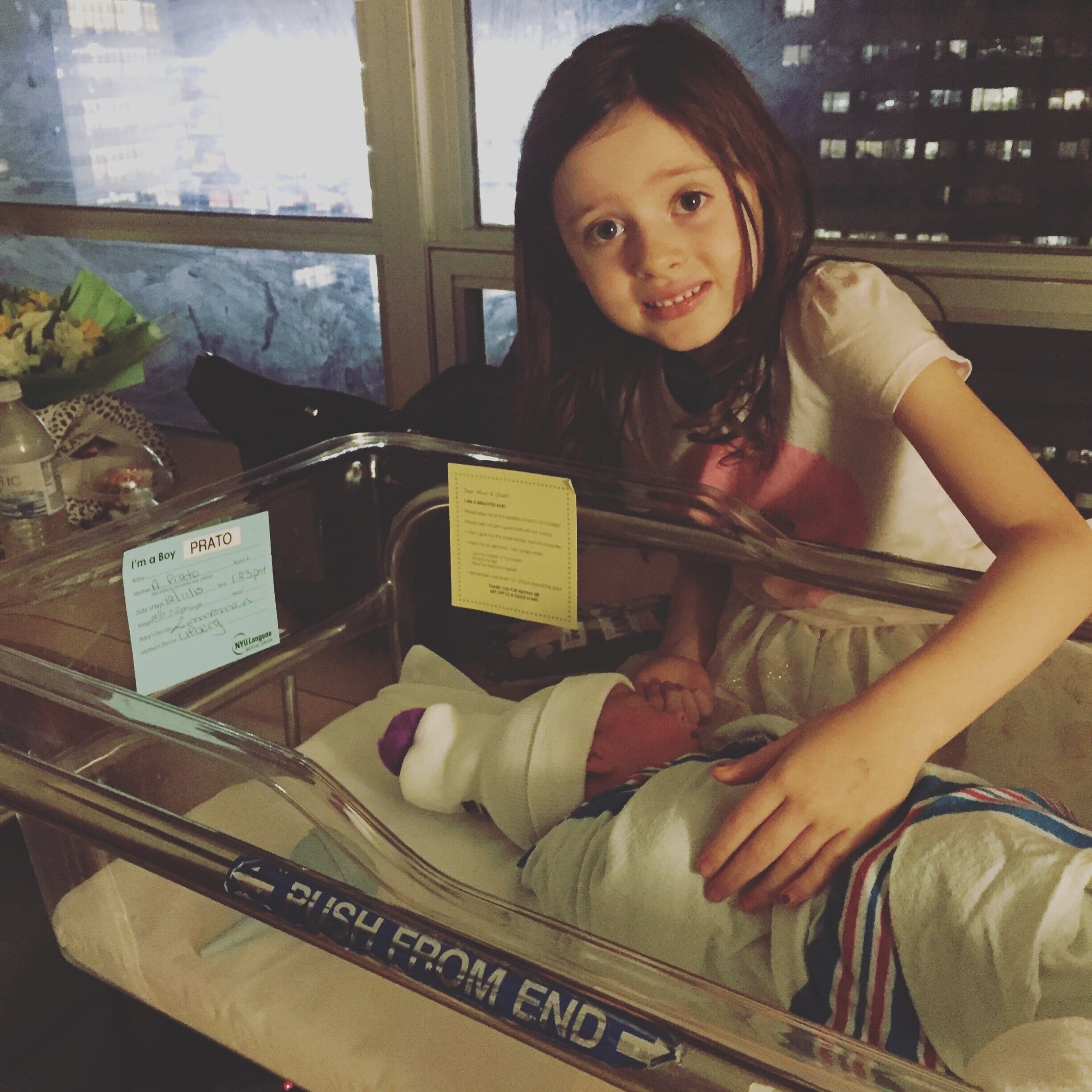 alison prato's daughter and newborn baby at the hospital
