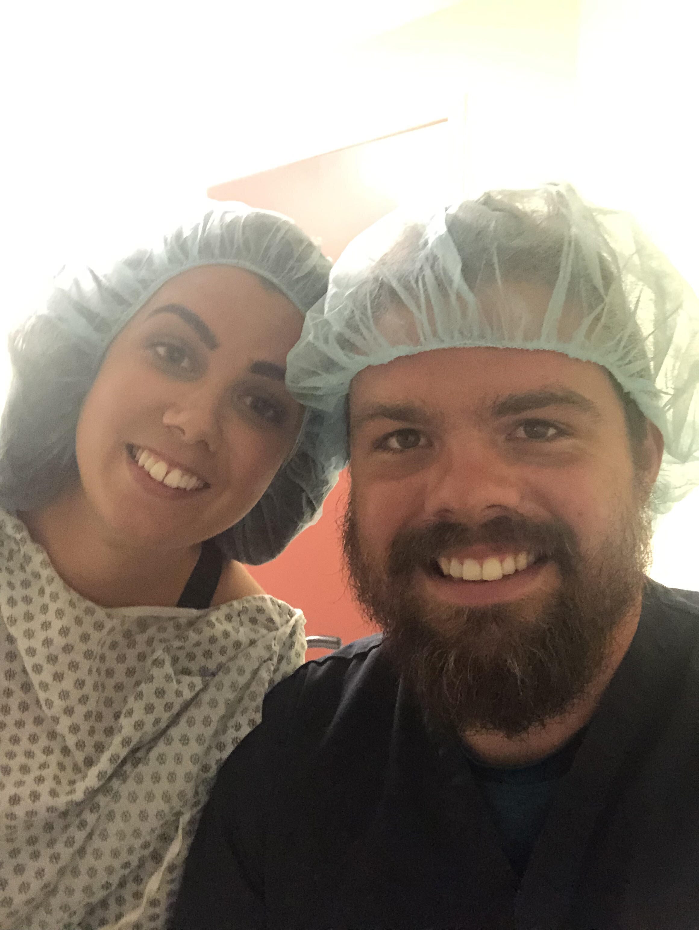 fertility warrior amy baker and her husband in the fertility clinic