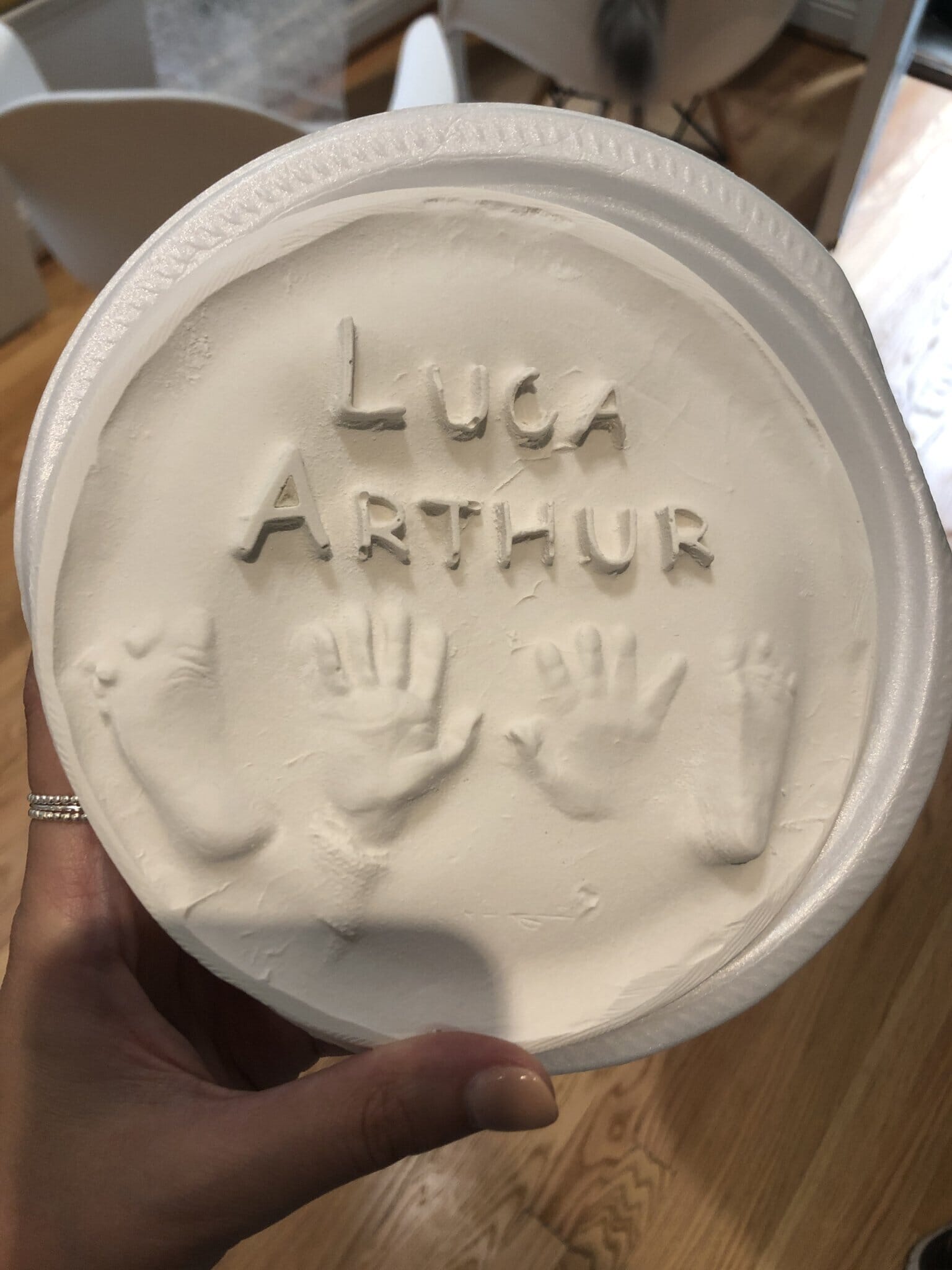 ceramic plate with baby's handprints and footprints