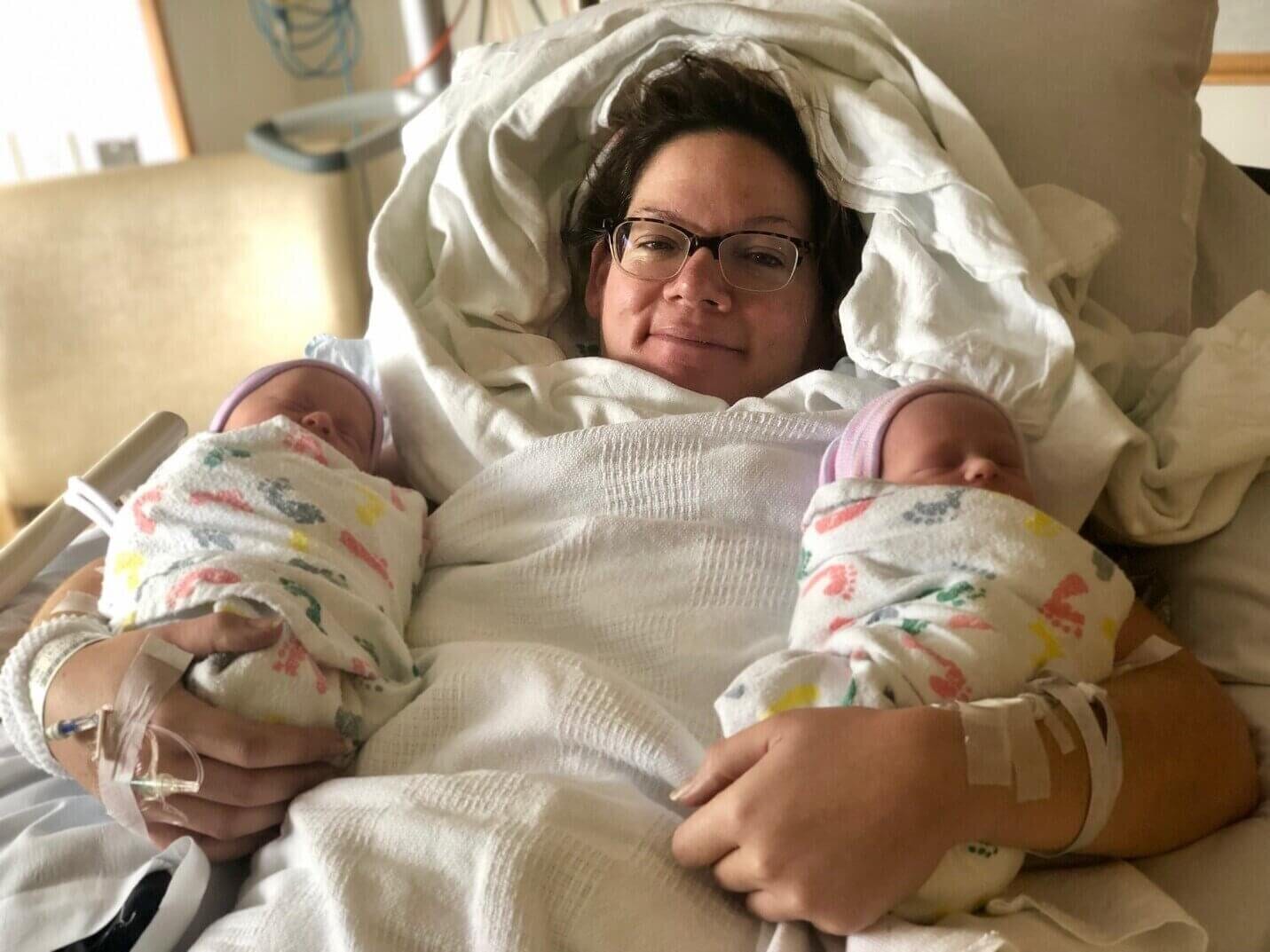 elizabeth osberger holding her twins in the hospital