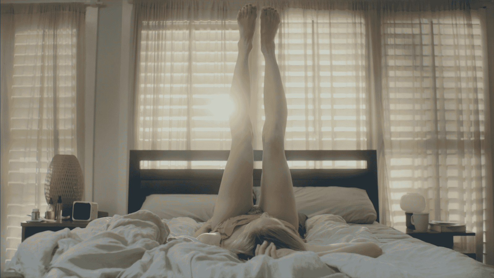 woman post-coital with her legs up trying to conceive